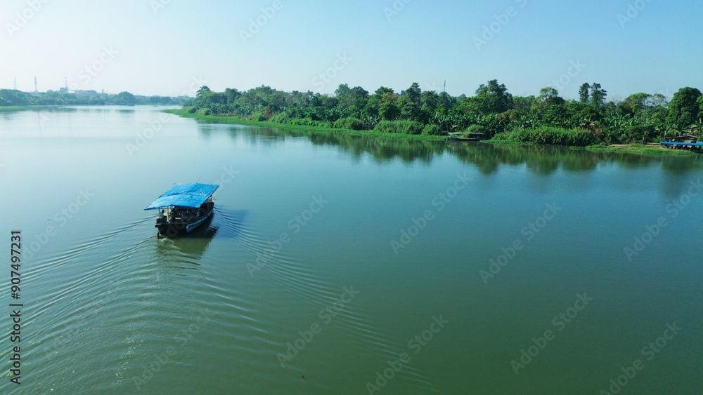 Aerial view, wooden ship crossing the river in Makassar City Aerial view, wooden ship crossing the river in Makassar City