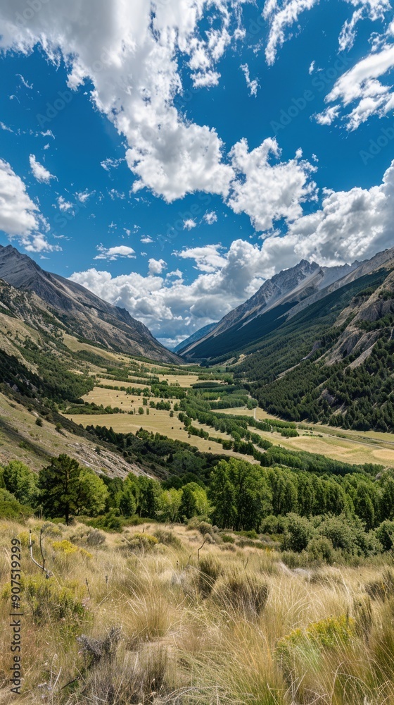 Scenic mountain valley with lush greenery and a blue sky. Scenic mountain valley with lush greenery and a blue sky.