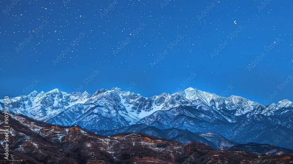 The Magnificent Snow-Capped Mountains Against the Blue Sky Background at Night in Rizhao Jinshan. A Stunning Natural Sight that Evokes Peace and Awe. The Beauty of Nature in Its Pristine Form. The Magnificent Snow-Capped Mountains Against the Blue Sky Background at Night in Rizhao Jinshan. A Stunning Natural Sight that Evokes Peace and Awe. The Beauty of Nature in Its Pristine Form.