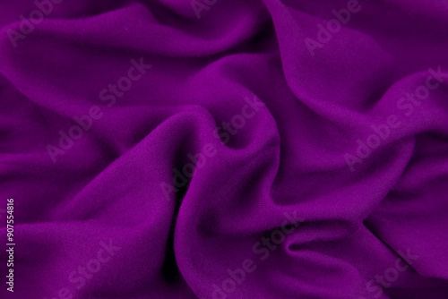 Purple fabric background. Purple cloth waves background texture. Purple fabric cloth textile material.
