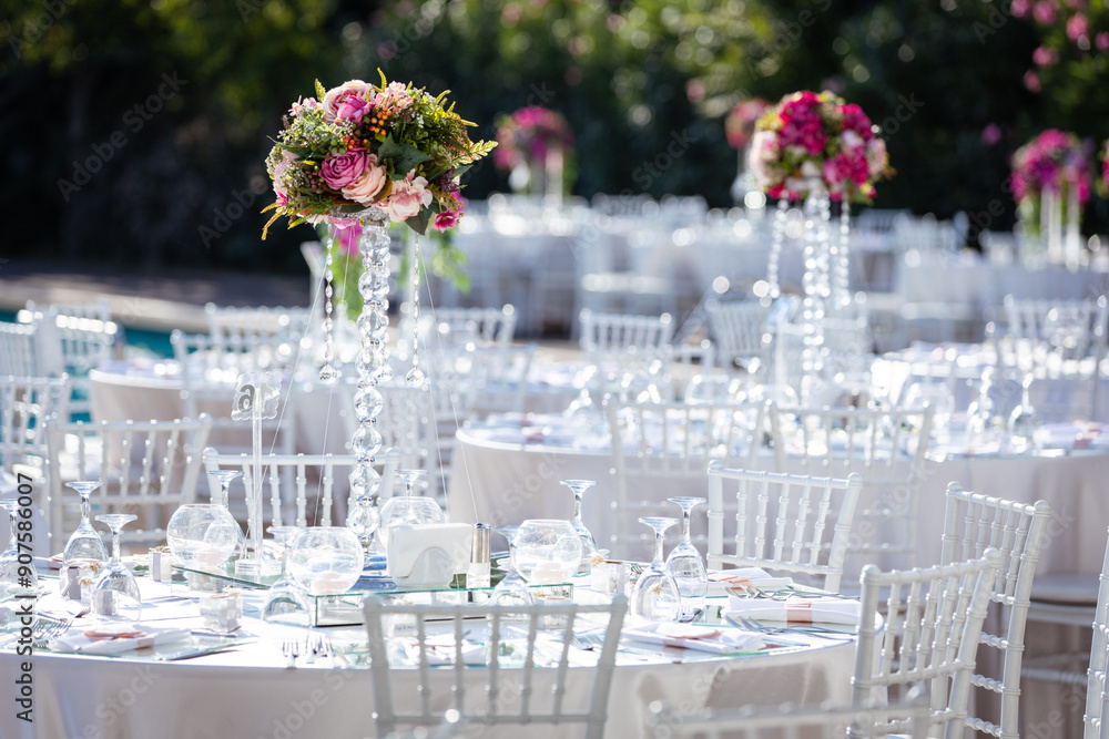 Beautifully Decorated Wedding Tables by the Swimming Pool Outdoors