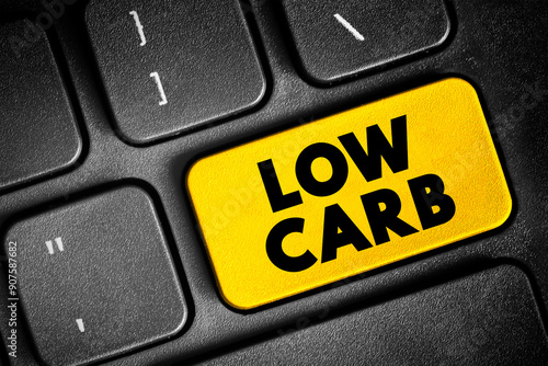 Low Carb - diet means that you eat fewer carbohydrates and a higher proportion of protein and fat, text concept button on keyboard photo