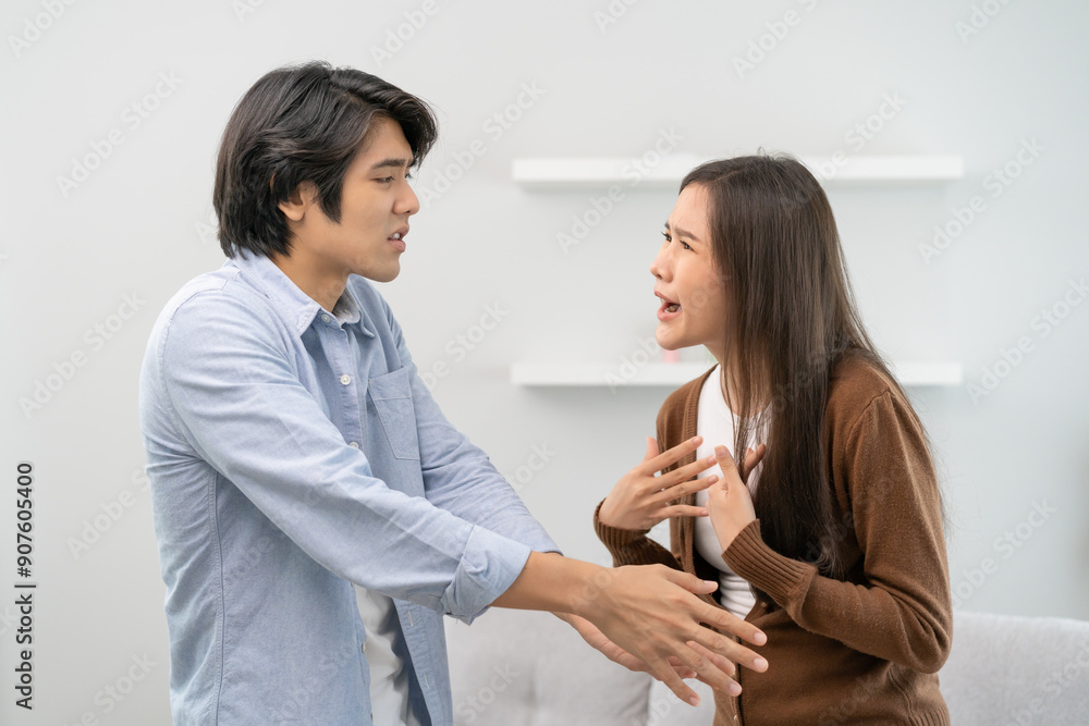 Family problems, Asian couple quarrel together at home. woman angry on man and man feel annoy. Family problems, Asian couple quarrel together at home. woman angry on man and man feel annoy.