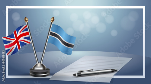 United Kingdom and Botswana Small national flag on bokeh background, cooperative relationship