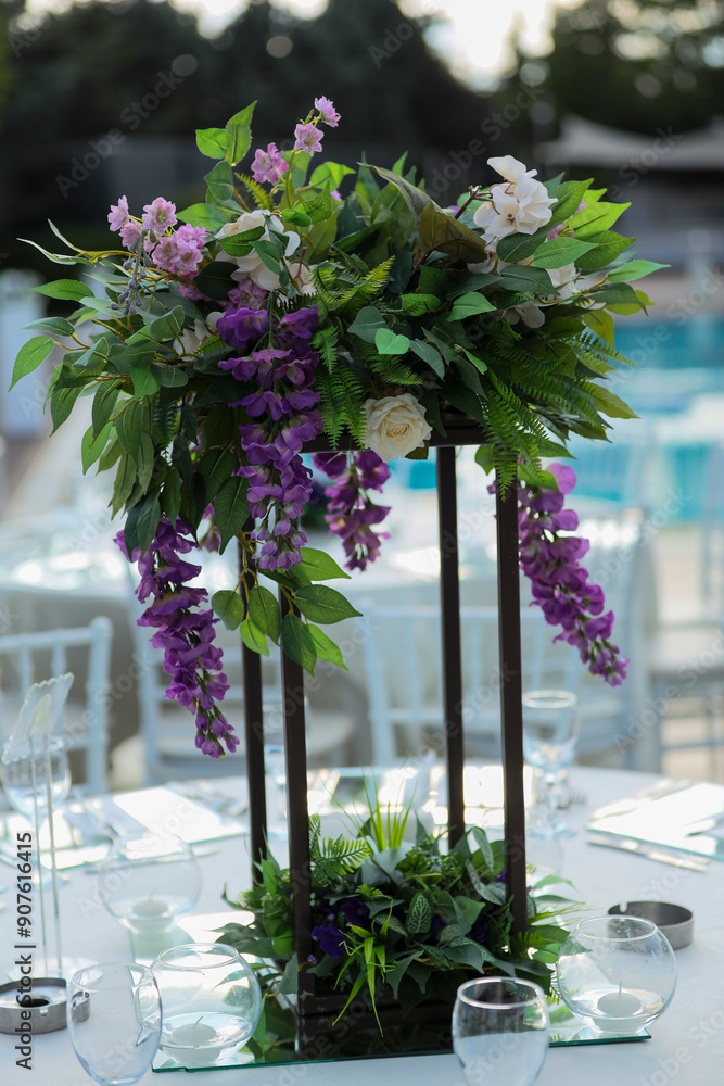 Beautifully Decorated Wedding Tables with Purple Flowers at Garden Event