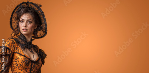 woman in halloween costume at color background with empty space for text and design