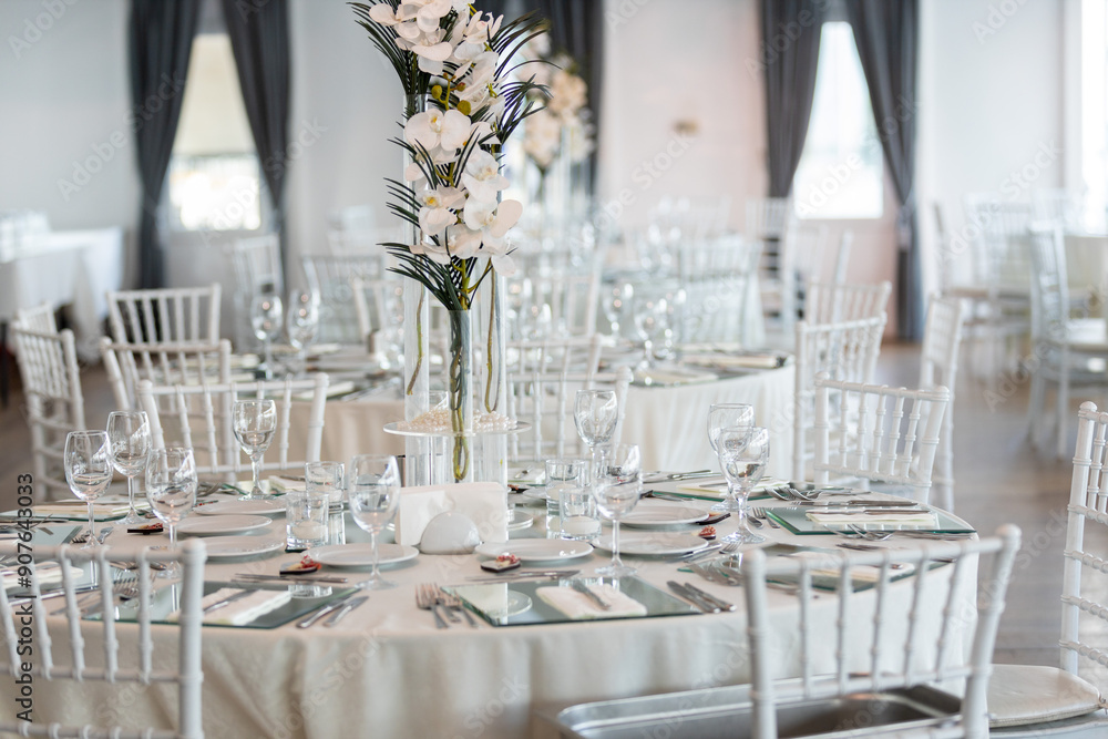 Indoor Wedding Reception: Round Tables with Unique Floral Centerpieces
