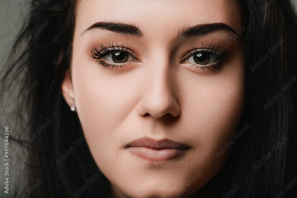Young woman with brown eyes making eye contact Young woman with brown eyes making eye contact