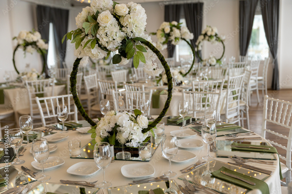 Indoor Wedding Reception: Round Tables with Unique Floral Centerpieces