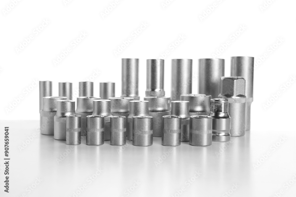 Set of different sockets on white background. Auto mechanic's tools Set of different sockets on white background. Auto mechanic's tools