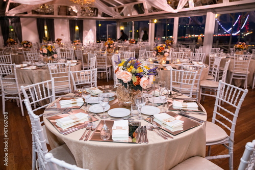 Romantic Dinner Setup: Table with Sunflower Bouquet and Cityscape at Night