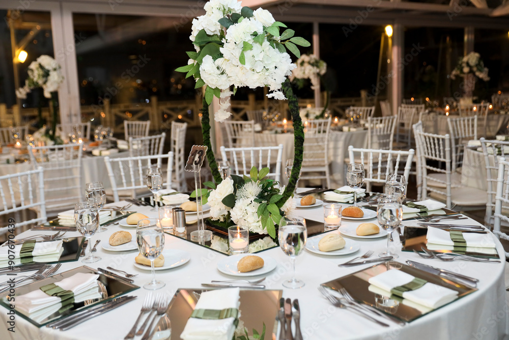 Romantic Dinner Setup: Table with Sunflower Bouquet and Cityscape at Night