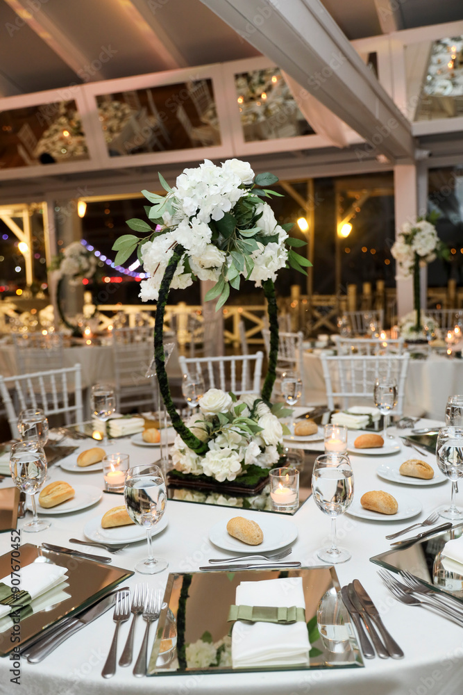 Romantic Dinner Setup: Table with Sunflower Bouquet and Cityscape at Night