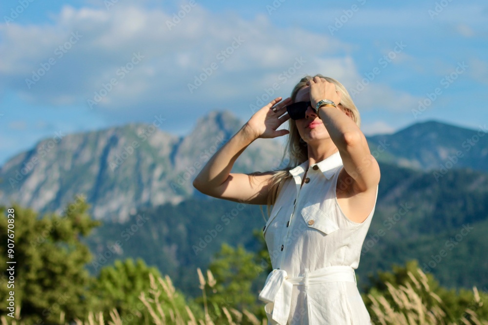 A young beautiful woman is enjoying her vacation in the Great Tatra Mountains A young beautiful woman is enjoying her vacation in the Great Tatra Mountains