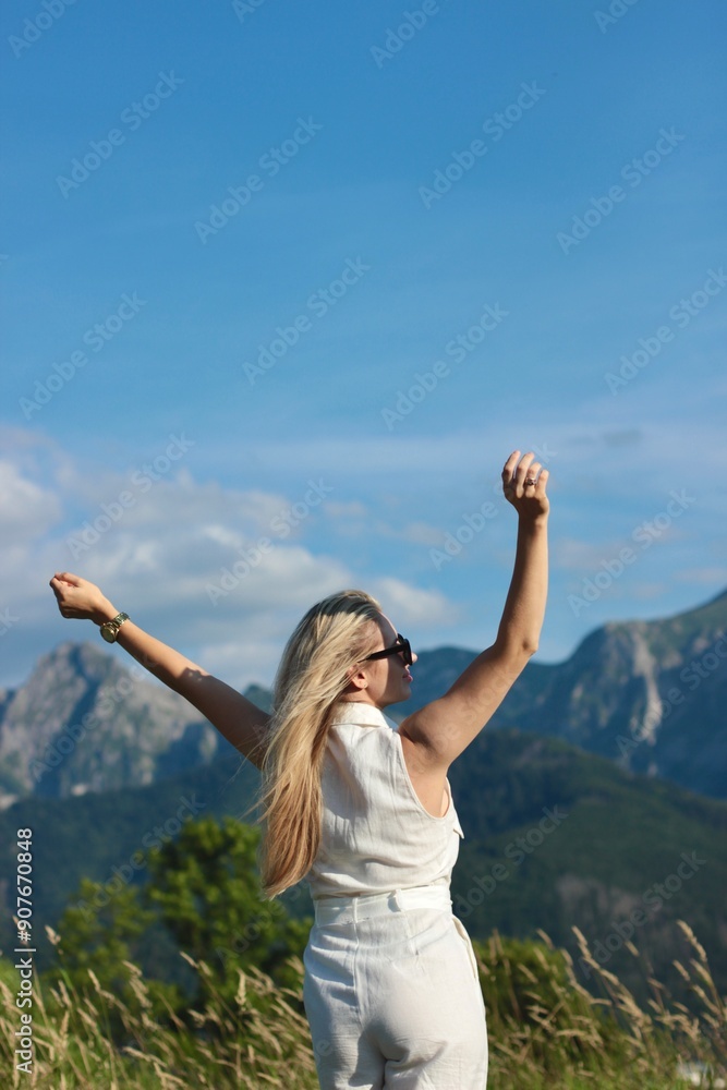 A young beautiful woman is enjoying her vacation in the Great Tatra Mountains A young beautiful woman is enjoying her vacation in the Great Tatra Mountains