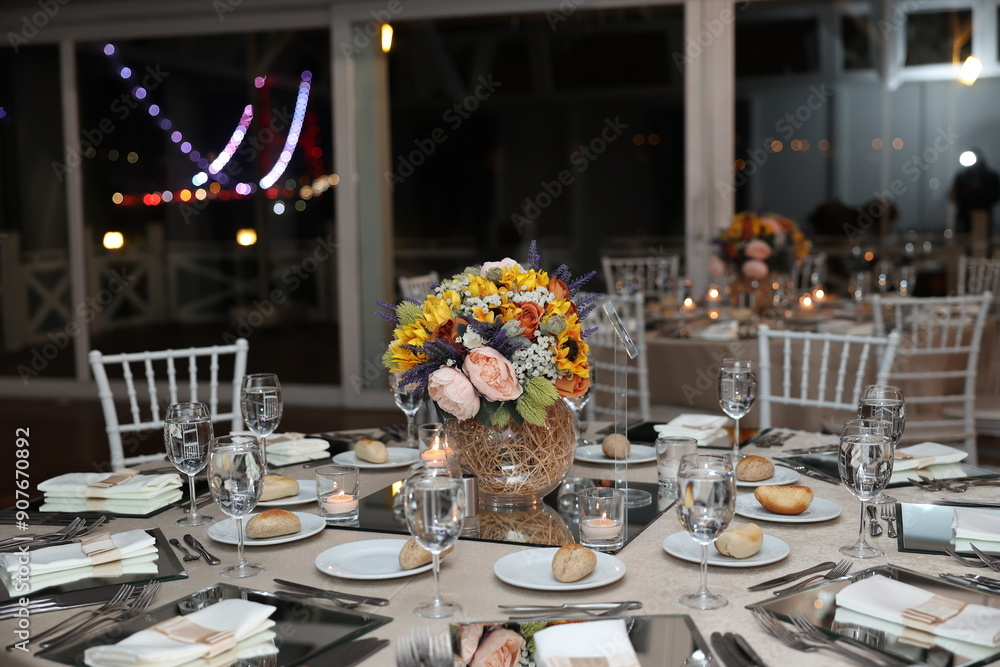 Indoor Wedding Reception: Round Table with Floral Decor and Urban View