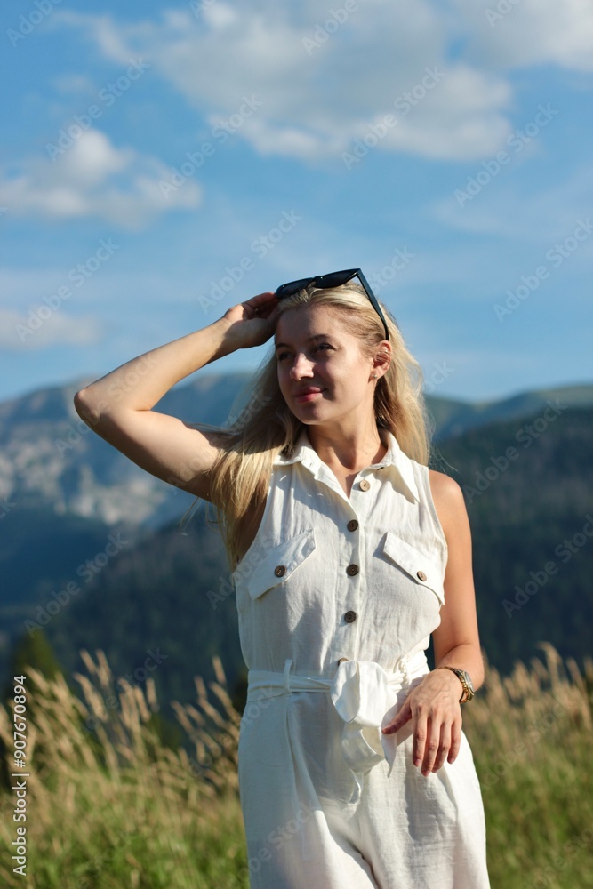 A young beautiful woman is enjoying her vacation in the Great Tatra Mountains A young beautiful woman is enjoying her vacation in the Great Tatra Mountains