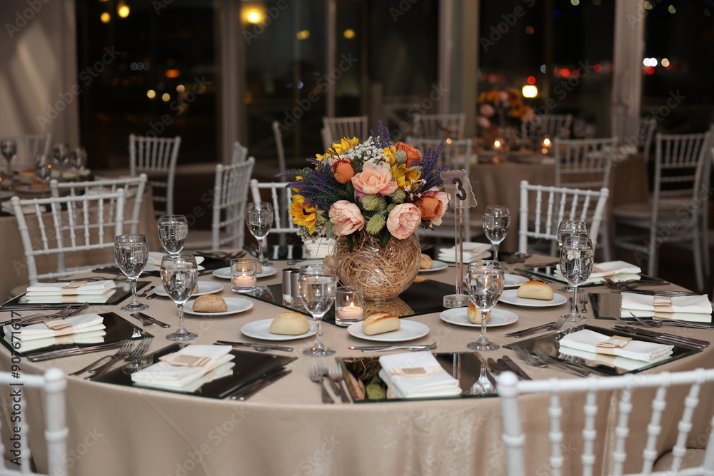 Elegant Wedding Table Setting with Sunflower Centerpiece and City Lights