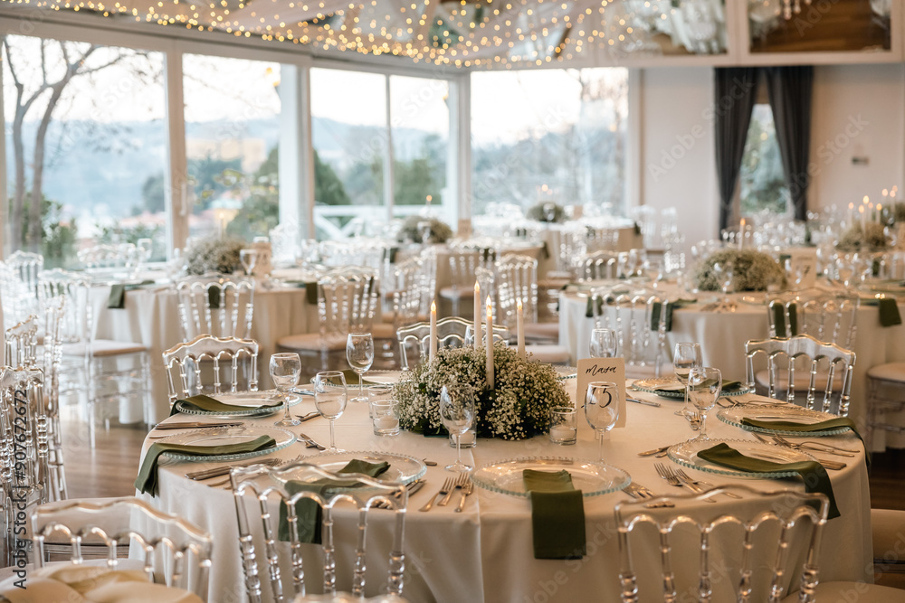 Romantic reception table with floral centerpiece and soft candlelight