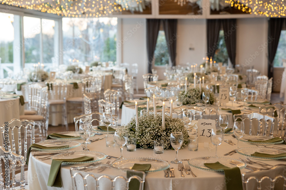 Romantic reception table with floral centerpiece and soft candlelight