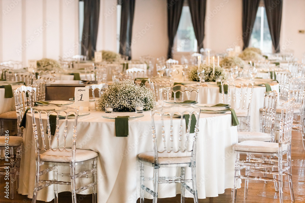 Romantic reception table with floral centerpiece and soft candlelight