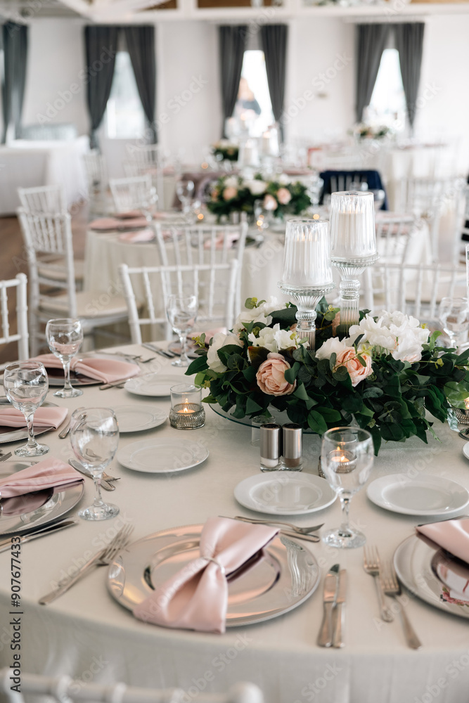 Elegant Indoor Wedding Reception with Pink and White Floral Centerpieces and Candles