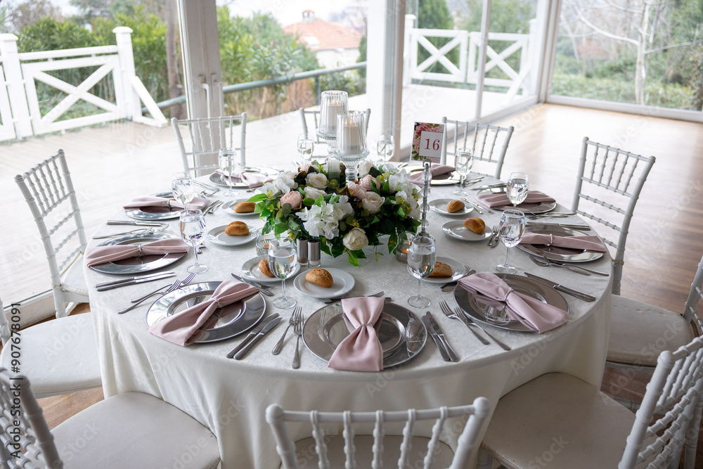 Elegant Indoor Wedding Reception with Pink and White Floral Centerpieces and Candles
