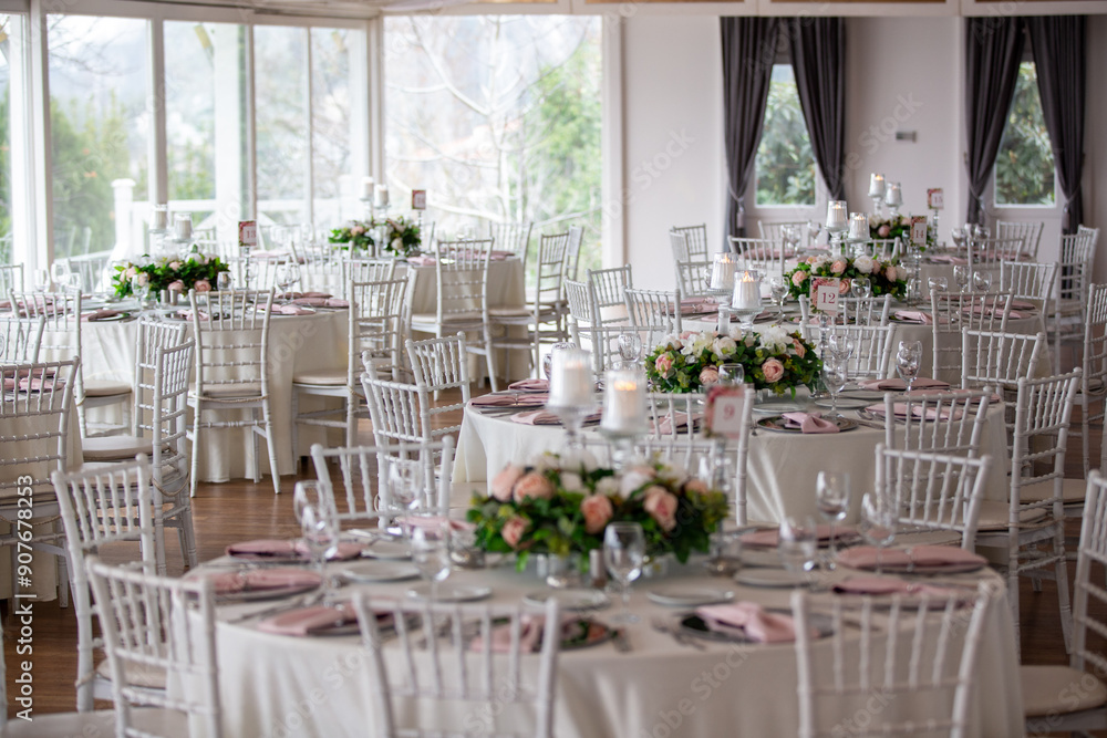 Luxury Wedding Table Setting with Pastel Flowers and Soft Candlelight Indoors
