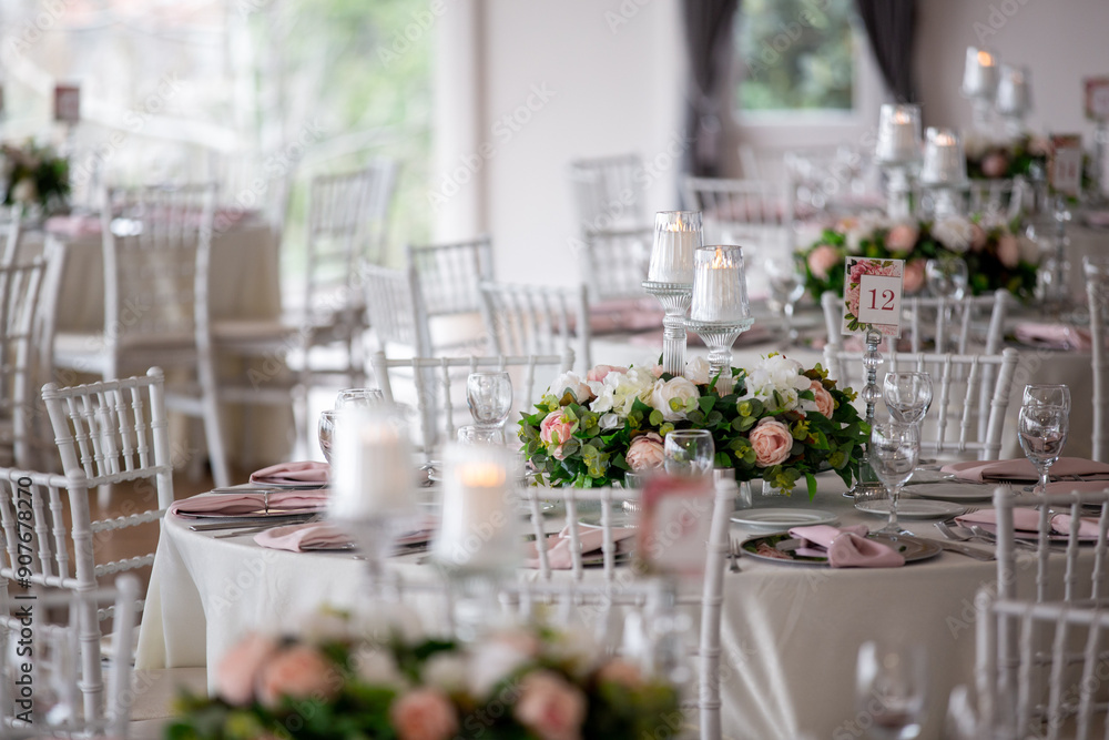 Luxury Wedding Table Setting with Pastel Flowers and Soft Candlelight Indoors