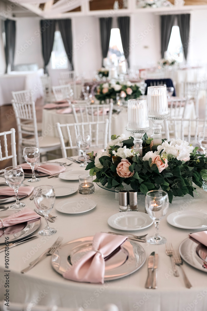 Elegant Indoor Wedding Reception with Pink and White Floral Centerpieces and Candles