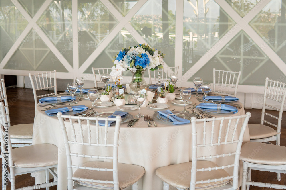 Beautiful Wedding Venue in Istanbul: Tables with Floral Centerpieces and Bridge View