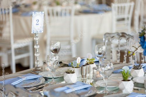 Obraz na płótnie Beautiful Wedding Venue in Istanbul: Tables with Floral Centerpieces and Bridge View w salonie