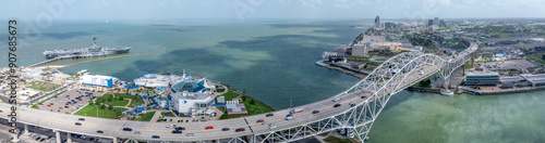 panoramic aerial landscape view around Corpus Christi Bay and Nueces Bay with Nueces Bay Causeway, U.S.181 Highway, Texas State Aquarium, USS Lexington and Corpus Christi Skyline in Background