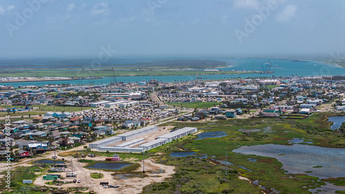 Port Aransas, USA, aerial city view of area around Port Aransas Ferry Landing and boat harbor, located on Mustang Island at Gulf of Mexico with infrastructure for ferry landing