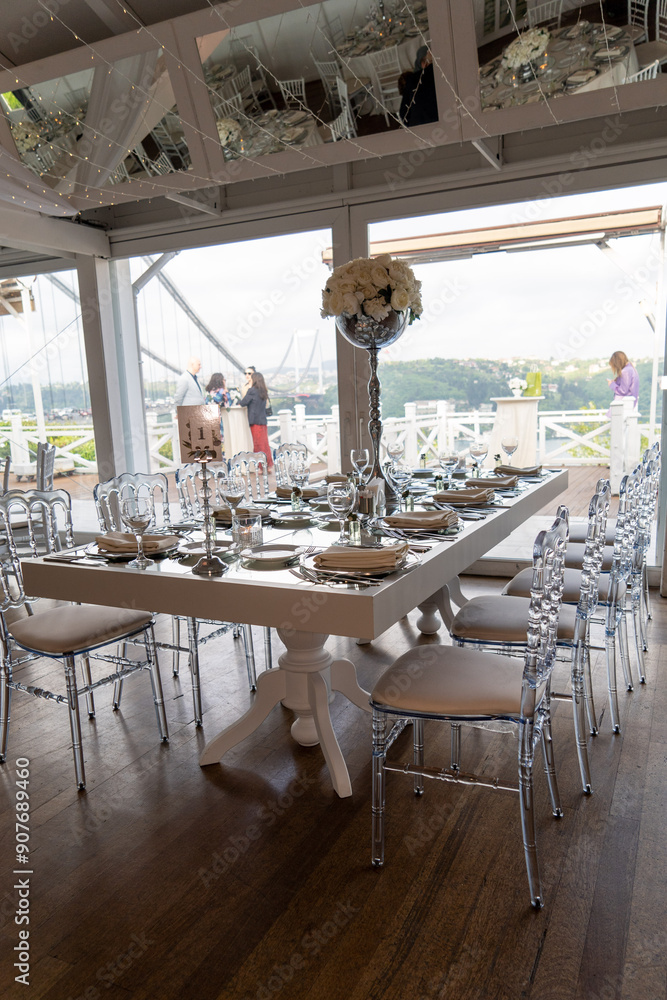 Stylish Outdoor Reception: Lounge Furniture with Floral Accents and Urban Panorama