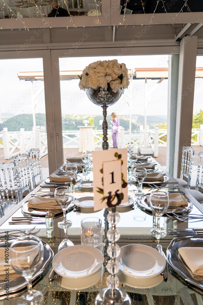 Stylish Outdoor Reception: Lounge Furniture with Floral Accents and Urban Panorama