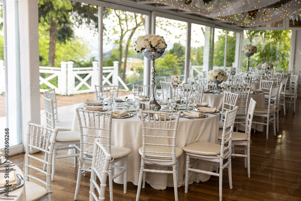 Stylish Outdoor Reception: Lounge Furniture with Floral Accents and Urban Panorama