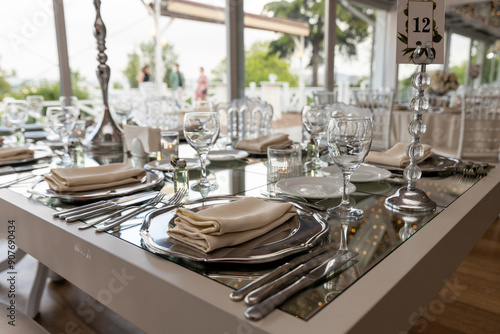 Stylish Outdoor Reception: Lounge Furniture with Floral Accents and Urban Panorama