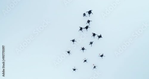 Cute funny penguins walking snow covered hill in Antarctica. Sea birds colony migration. Wildlife animal behavior in Antarctica. Travel, discover beauty of South Pole wild nature. Aerial top down view