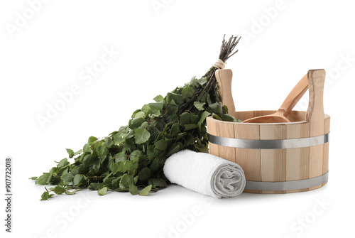 Sauna equipment. Wooden bucket with ladle, birch whisk and towel isolated on white photo