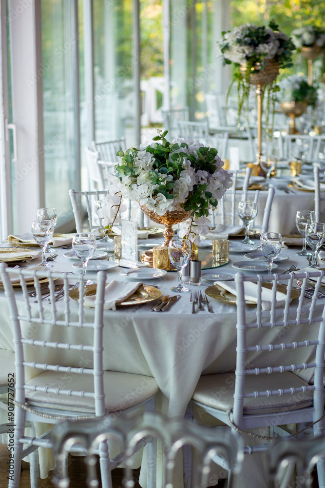 Elegant Wedding Table with White Flowers and Greenery at Outdoor Reception