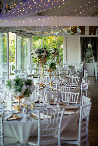 Elegant Wedding Table with White Flowers and Greenery at Outdoor Reception
