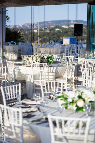Elegant Wedding Table with White Flowers and Greenery at Outdoor Reception