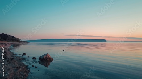 Tranquil sea mirroring the vibrant pastel sky during sunset, evoking a serene and peaceful ambiance