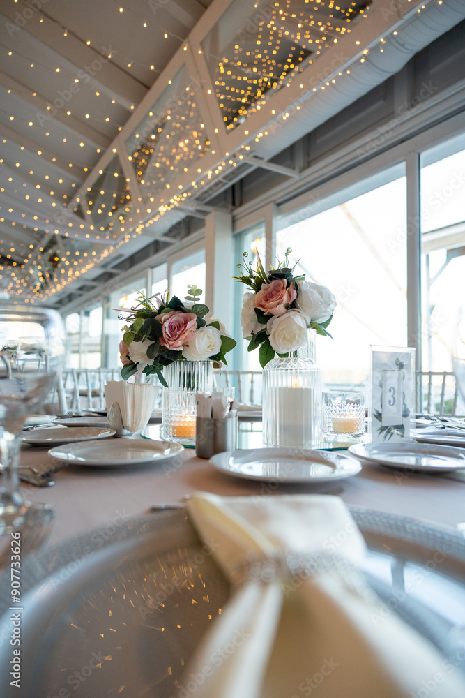 Elegant Wedding Table with Pastel Flowers and Greenery at Indoor Reception