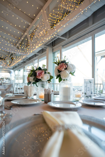 Elegant Wedding Table with Pastel Flowers and Greenery at Indoor Reception