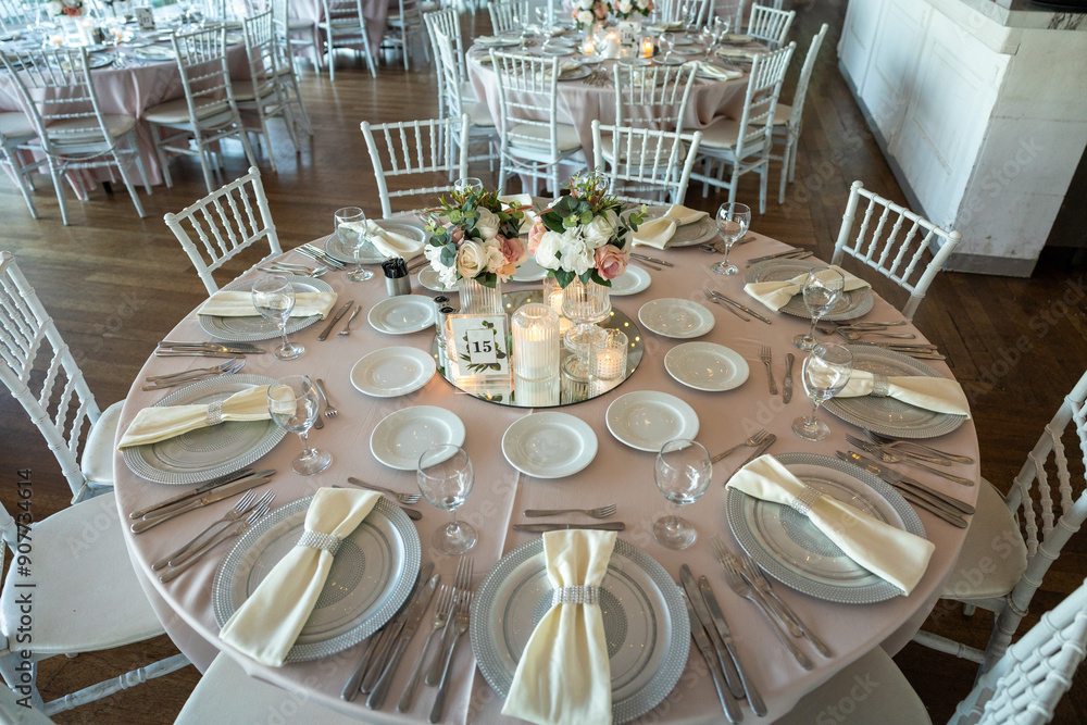Elegant Wedding Table with Pastel Flowers and Greenery at Indoor Reception