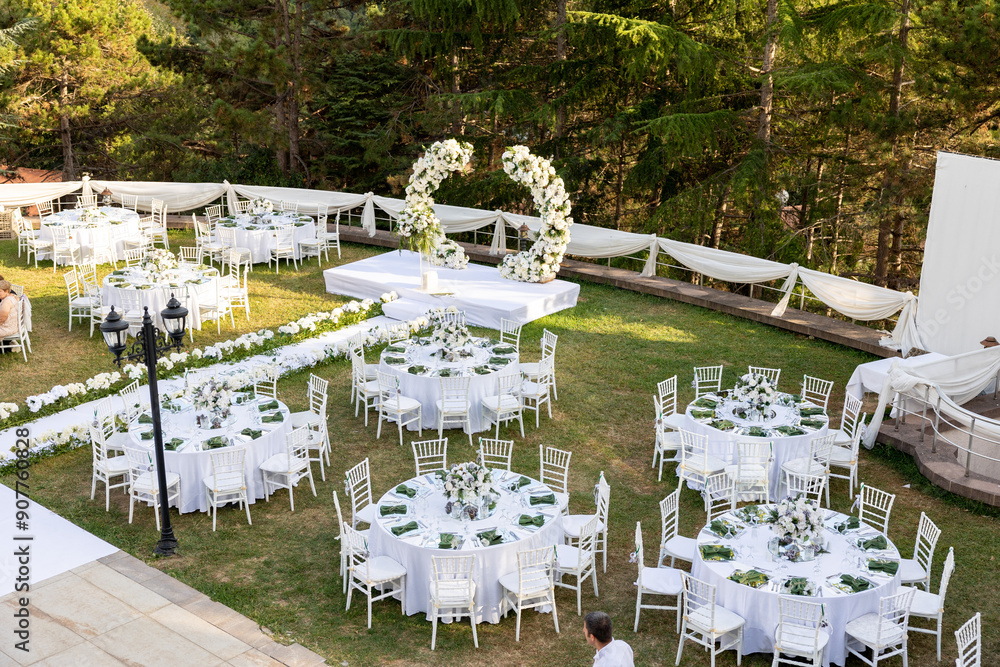 Elegant Outdoor Wedding Reception with Wisteria Floral Centerpieces