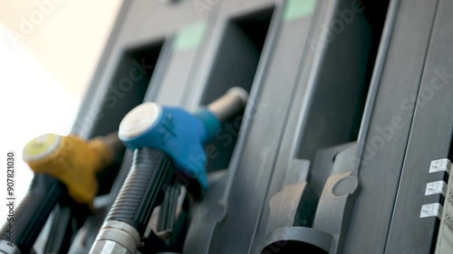 Refueling a Car at Gas Station with a fuel pump for oil or gasoline to fill up