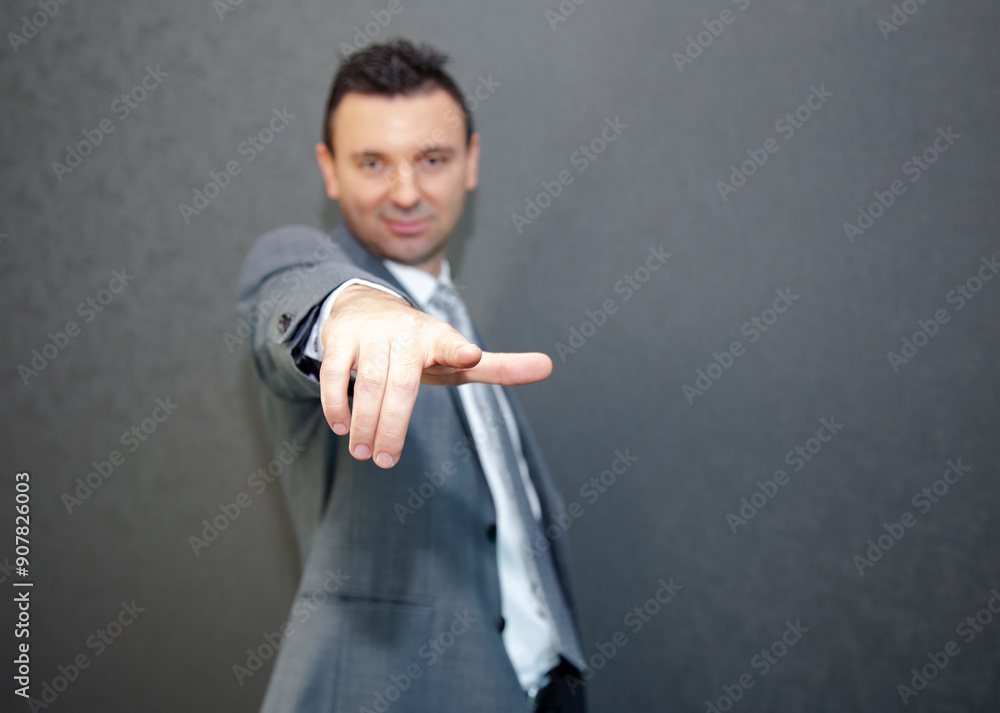 business man pointing at camera very relaxed and confident business man pointing at camera very relaxed and confident